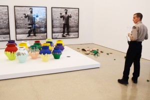 Miami, United States. 16th February 2014 -- Maximo Caminero, 51,  smashed a  million vase at the Perez Art Museum in Miami.  The vase was created by Chinese dissident artist Ai Weiwei.